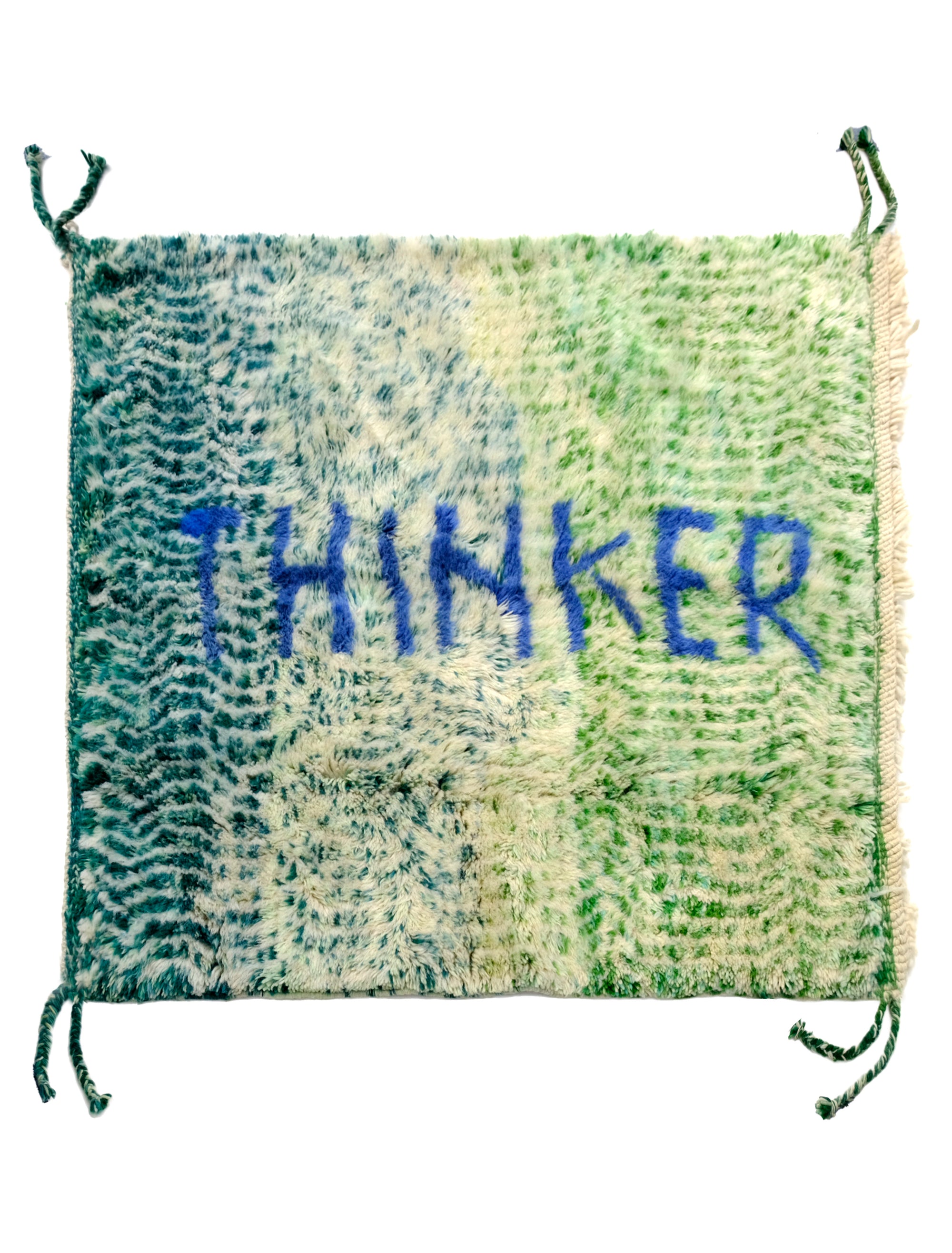 Introducing the 'Verdant Thinker Rug,' where the profound 'Thinker' letter is meticulously woven in blue yarn. Set against a backdrop of unique green and ivory curved wave lines, this rug brings a touch of intellectual charm to your space. Elevate your home with its artistic blend of colors and textures, creating a vibrant and thoughtful ambiance that resonates with modern sophistication.
