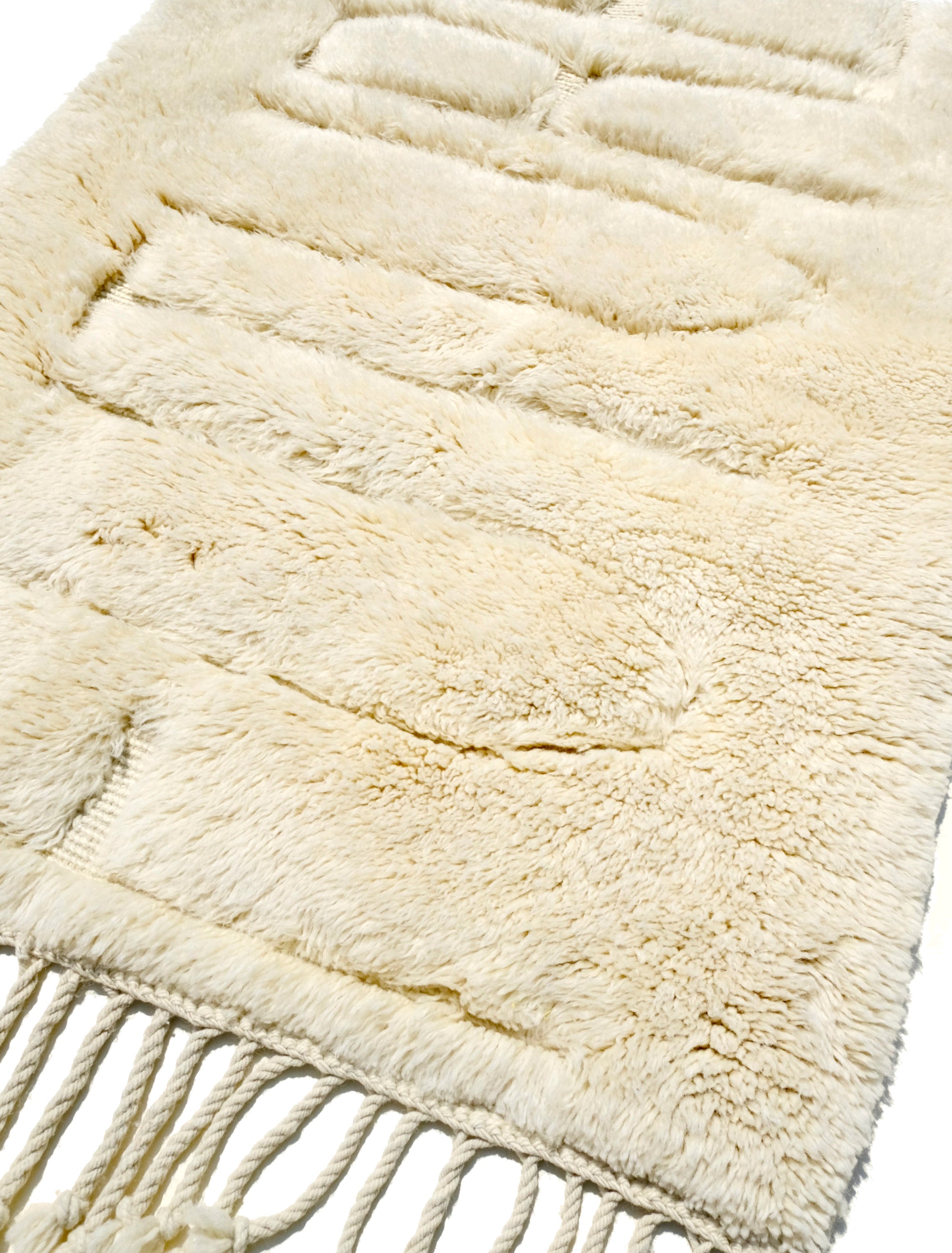 Elevate your space with our exquisite Ivory Enigma Future Rug. Crafted with classic elegance, this rug features a hidden 'Future' message subtly debossed into the luxurious fur. Discover a fusion of timeless style and contemporary intrigue, perfect for adding a touch of mystery to your décor