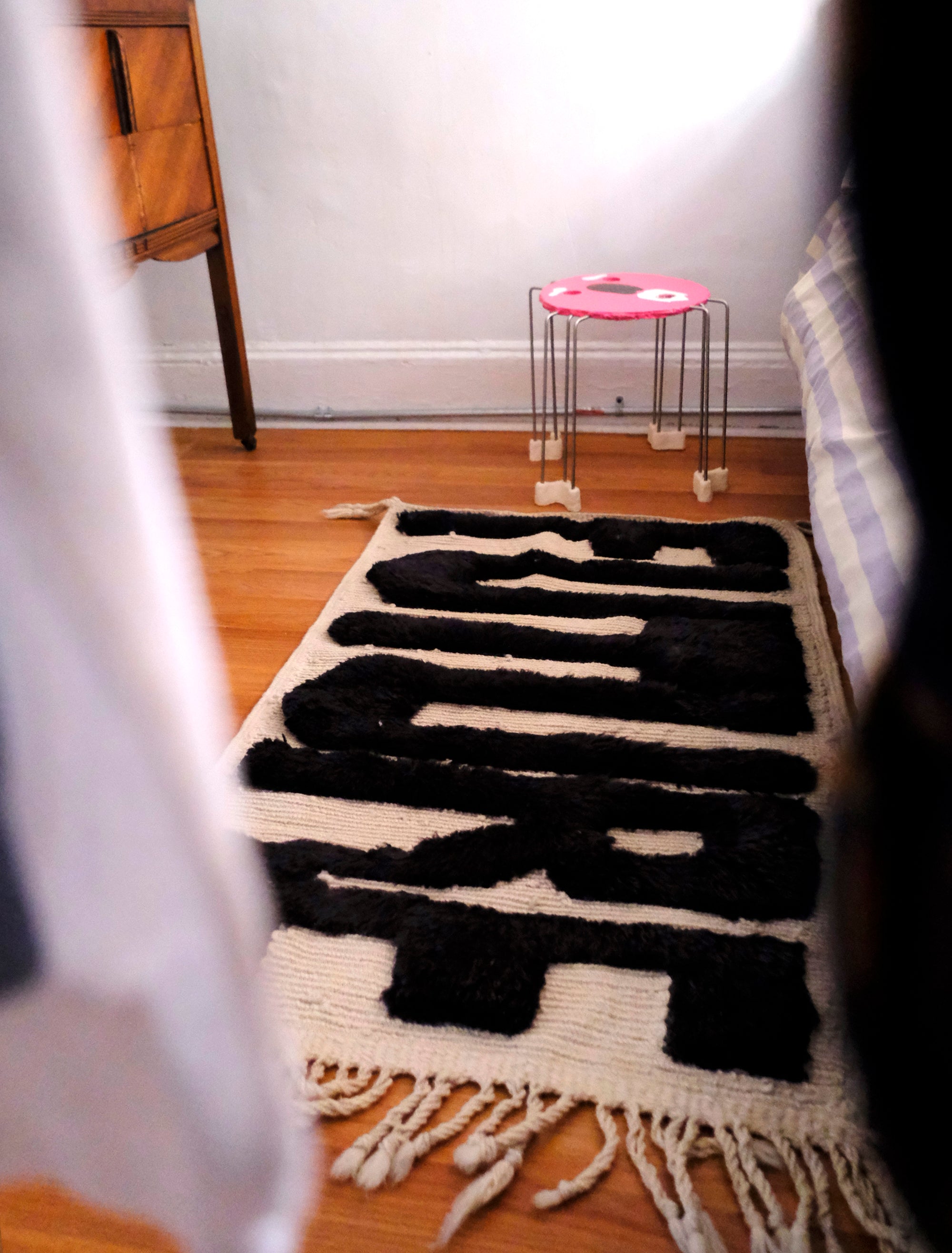 Elevate your space with the captivating "Ivory Noir Elegance Rug." Featuring embossed 'Future' letters in bold black yarn, this rug boasts a textured charm that adds a modern twist to classic black and white aesthetics. The result is a statement piece that seamlessly blends elegance and contemporary flair, making it an ideal addition to your home décor.