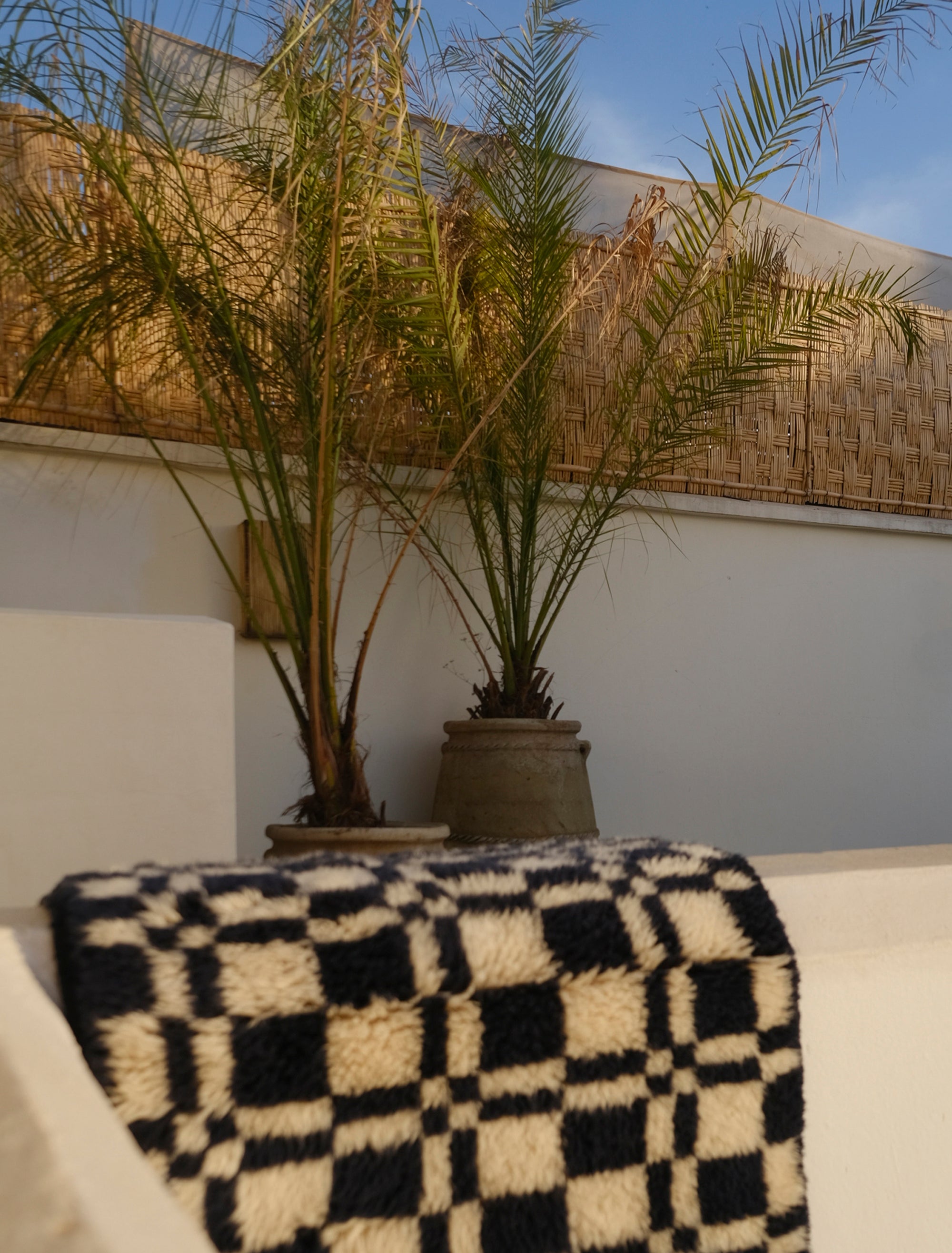 Discover the 'Navy Checkmate Rug' – a timeless blend of navy, ivory, and deep crimson in a classic checkerboard pattern. Elevate your space with this elegant, handcrafted piece that adds a touch of sophistication to any room. Explore our checkerboard collection for a stylish addition to your home decor.