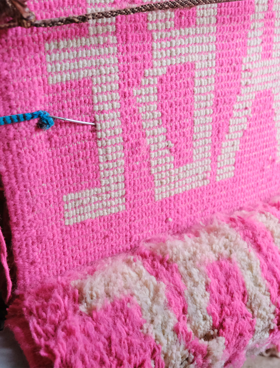 Meet our latest cushion made from a Beni Mrirt rug. Vibrant neon pink, adorned with the word "BABE" in white yarn, this 55x55cm delight effortlessly infuses joy into any space. It's not just decor; it's a celebration of style and comfort. Watch your room bloom with the playful charm of "Babe in Bloom," a vivid testament to the power of color and design.