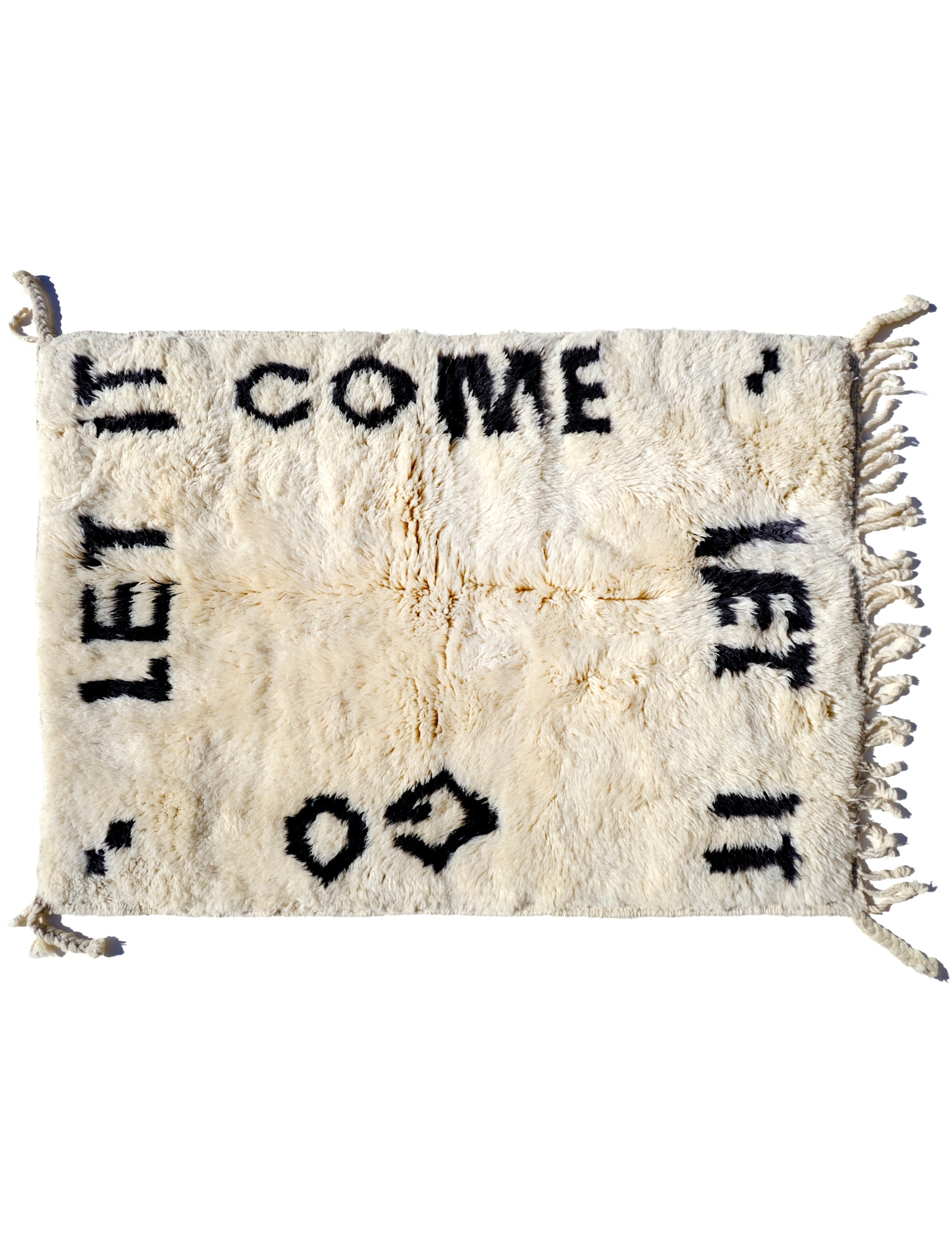 Indulge in comfort with our Ivory Serene Affirmations Rug, handcrafted in the Atlas Mountains. Its plush fibers offer a luxurious experience, while the subtle saying, 'let it come, let it go,' brings a calming touch to your space. Immerse yourself in Moroccan craftsmanship, transforming your home into a haven of tranquility.