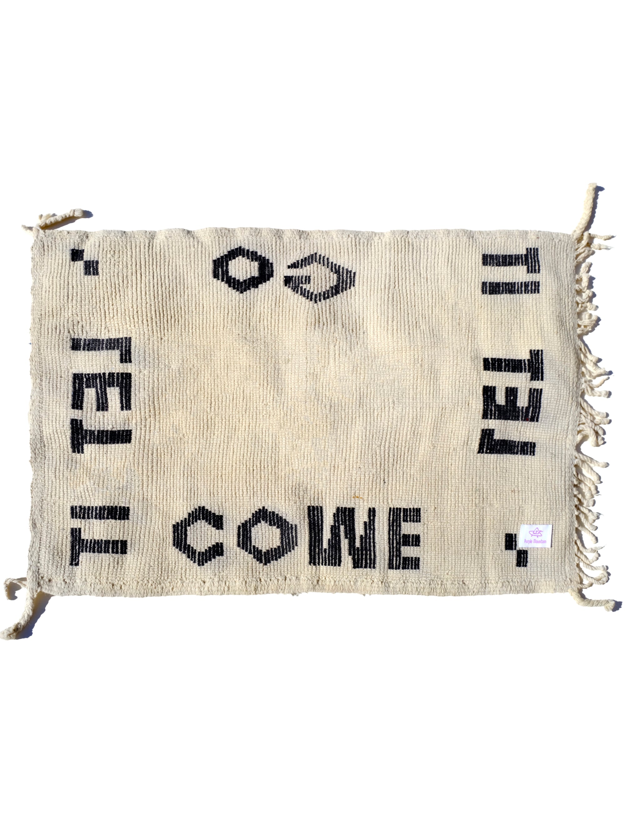Indulge in comfort with our Ivory Serene Affirmations Rug, handcrafted in the Atlas Mountains. Its plush fibers offer a luxurious experience, while the subtle saying, 'let it come, let it go,' brings a calming touch to your space. Immerse yourself in Moroccan craftsmanship, transforming your home into a haven of tranquility.