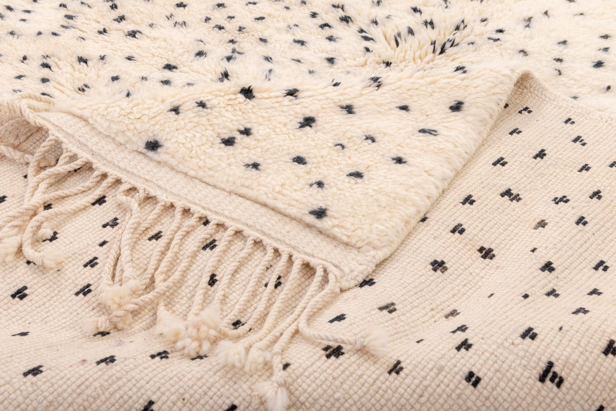 Elevate your interior with our 'Ivory Dotted Mirage Rug.' Featuring a playful pattern of degrading polka dots that transition from a dense cluster at the top to a scattered arrangement at the bottom, this rug adds a touch of whimsy and style to your space.