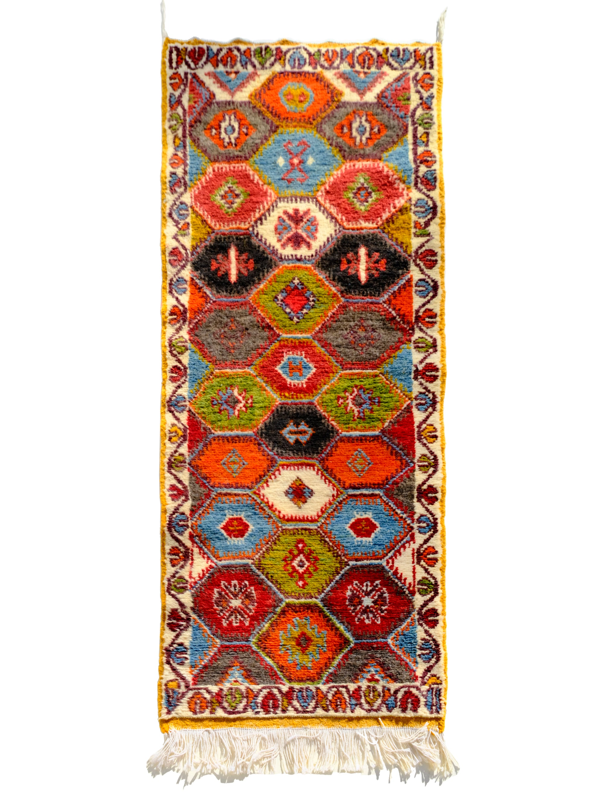Elevate your space with the Nomad's Embrace Taznakht Rug. This Moroccan-inspired masterpiece boasts a multicolor hexagon pattern, intricately piled up for a textured finish. Traditional yet contemporary, it adds warmth to any room. Bring cultural heritage to your home with this uniquely crafted Taznakht rug.