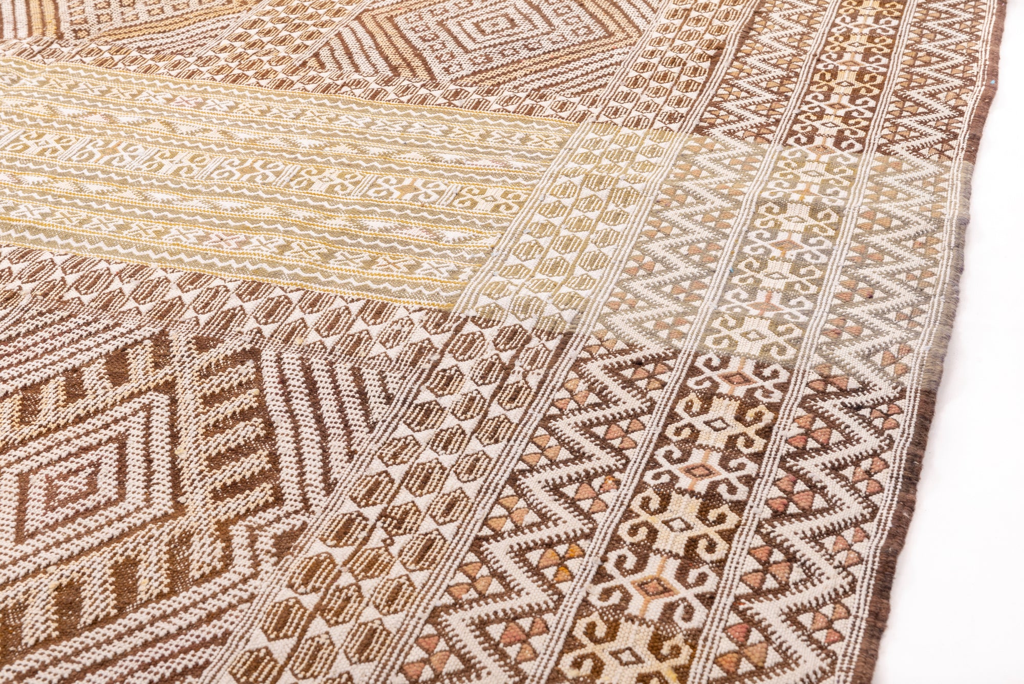 "Bask in the timeless allure of our Golden Desert Breeze Berber Kilim Rug. This rug boasts a classic Berber kilim pattern, blending pale cream and earthy brown tones. The intricate design reflects the rich heritage of Berber craftsmanship, adding a touch of warmth and sophistication to your space. Elevate your home with the charm of nomadic traditions and the inviting hues of the desert landscape. Embrace the artistry of this handwoven kilim, a perfect fusion of tradition and contemporary elegance."