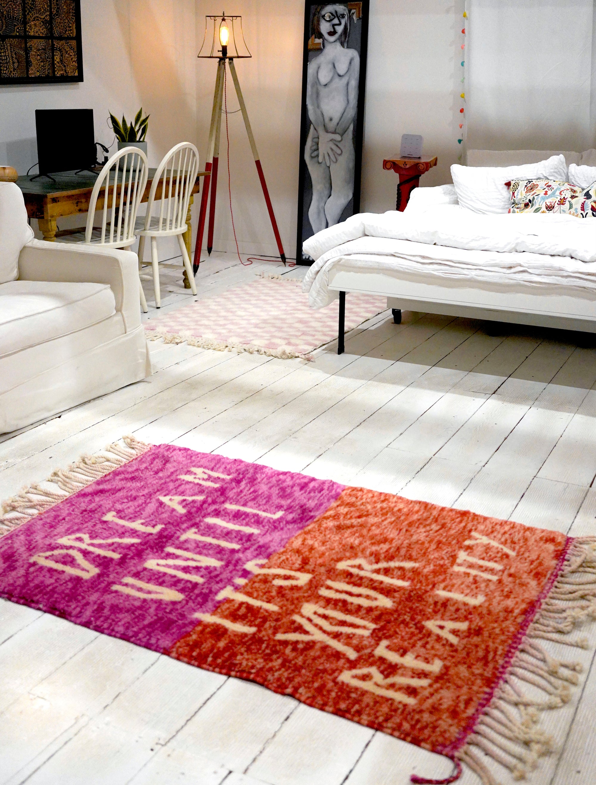Introducing the enchanting 'Rosy Dreamscape Rug,' a delightful fusion of pink and red yarns forming a playful base, with the inspiring phrase 'Dream Until It Is Your Reality' expertly woven in white yarn. Elevate your space with this captivating blend of colors and motivational message, creating a joyful and imaginative ambiance that adds a touch of beauty and positivity to your home.