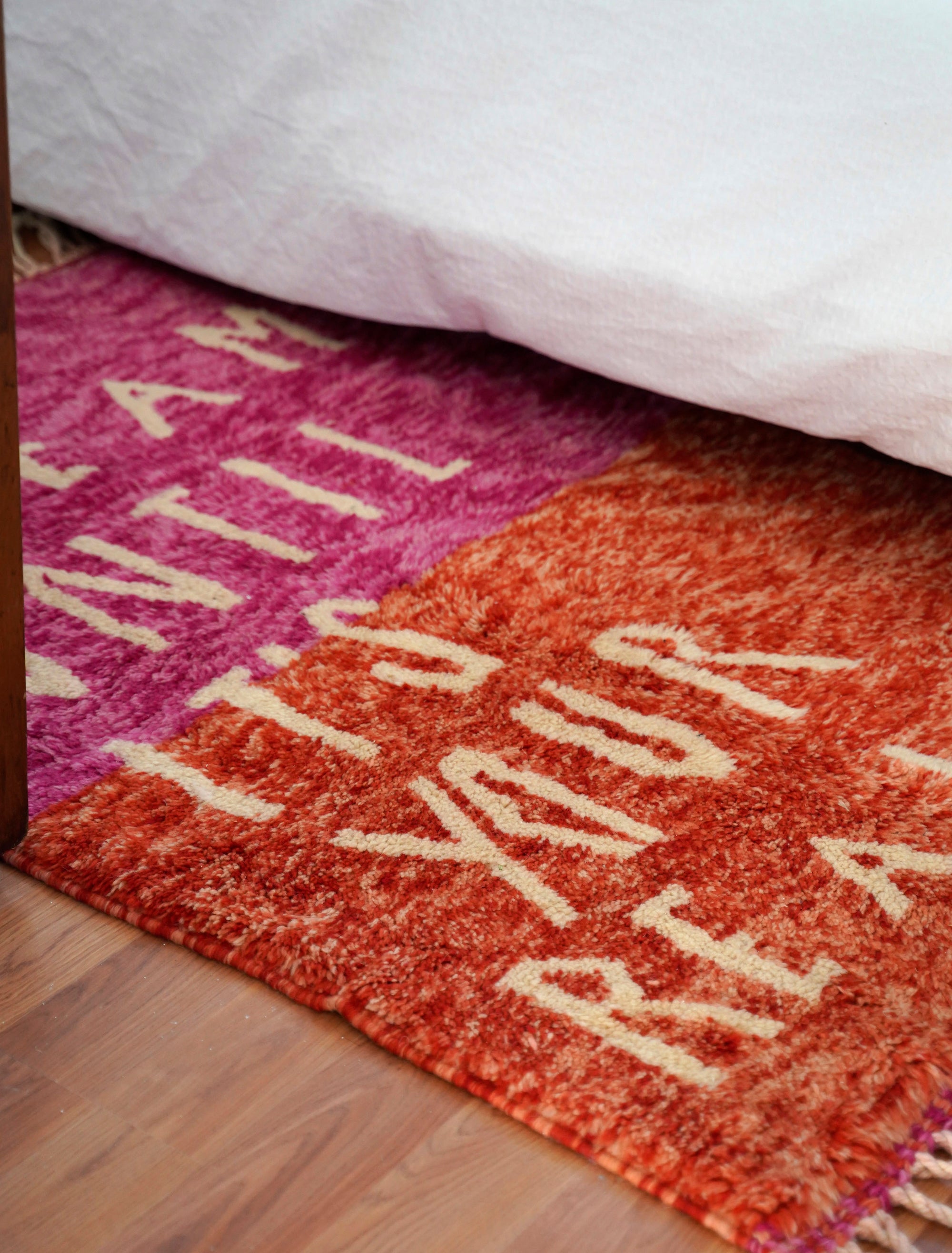Introducing the enchanting 'Rosy Dreamscape Rug,' a delightful fusion of pink and red yarns forming a playful base, with the inspiring phrase 'Dream Until It Is Your Reality' expertly woven in white yarn. Elevate your space with this captivating blend of colors and motivational message, creating a joyful and imaginative ambiance that adds a touch of beauty and positivity to your home.