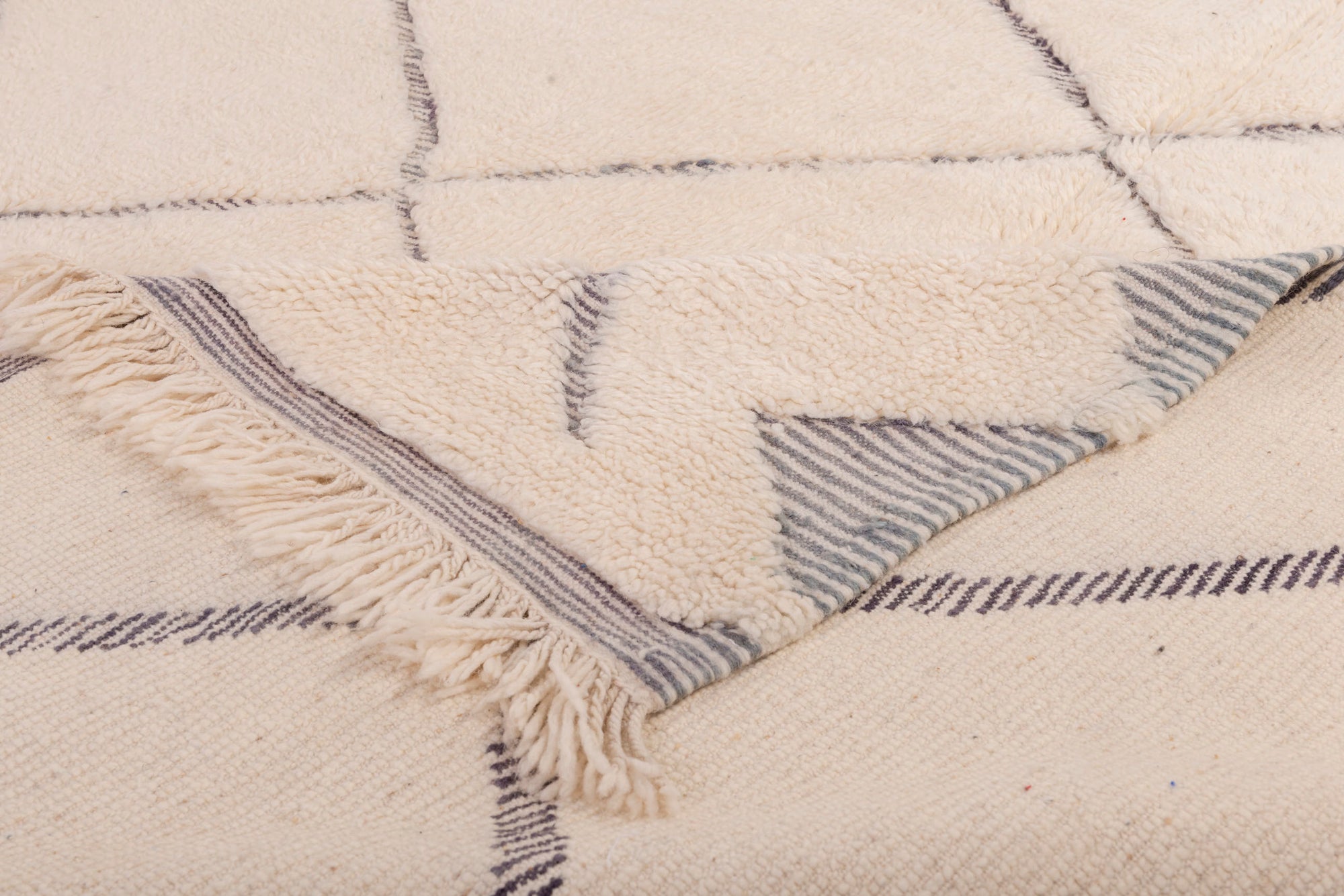 Enhance your space with our Ivory 3D Crosshatch Rug. This meticulously crafted rug features a captivating crisscross pattern in ivory and dark gray, creating a striking 3D effect that adds depth and sophistication to your decor.