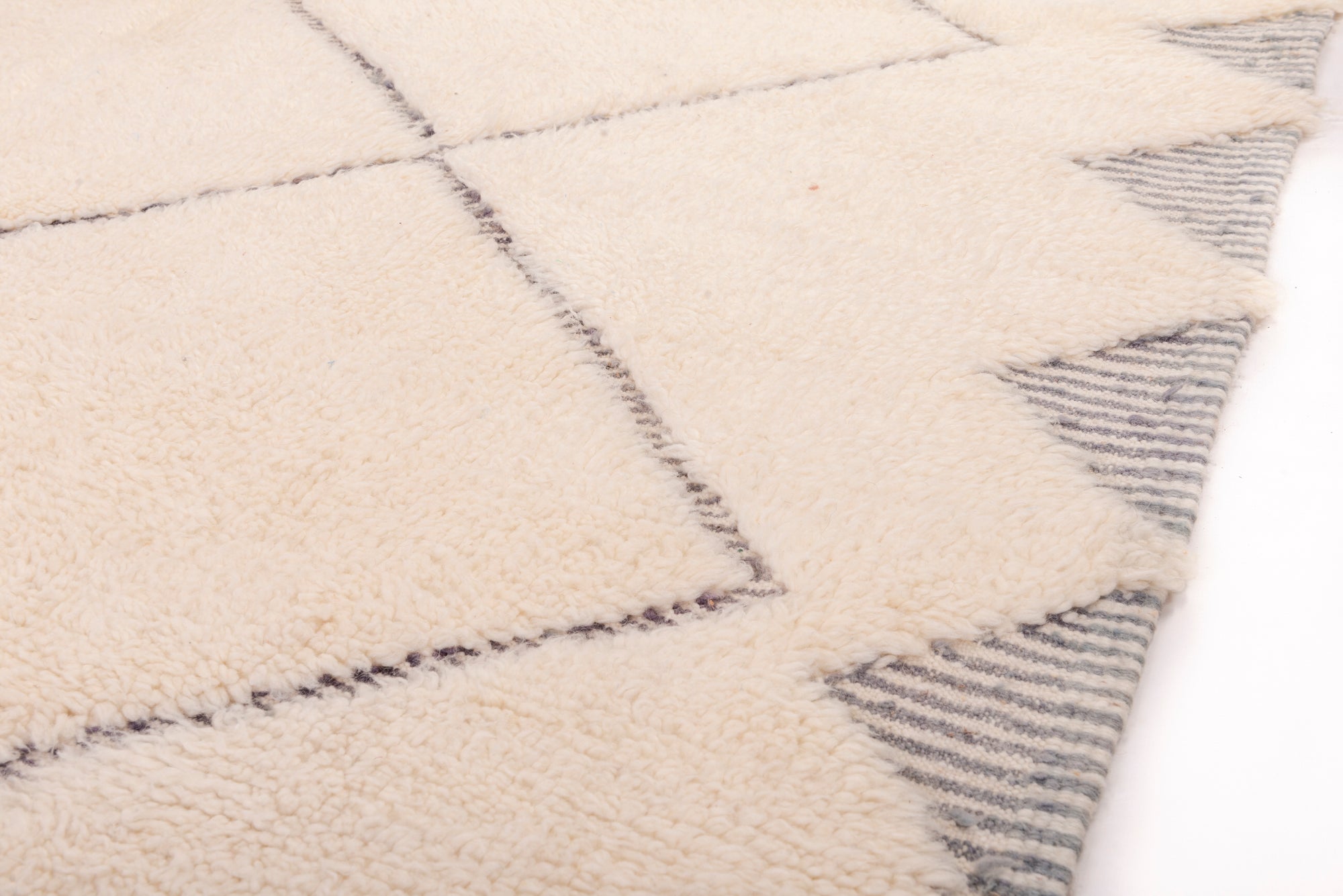 Enhance your space with our Ivory 3D Crosshatch Rug. This meticulously crafted rug features a captivating crisscross pattern in ivory and dark gray, creating a striking 3D effect that adds depth and sophistication to your decor.