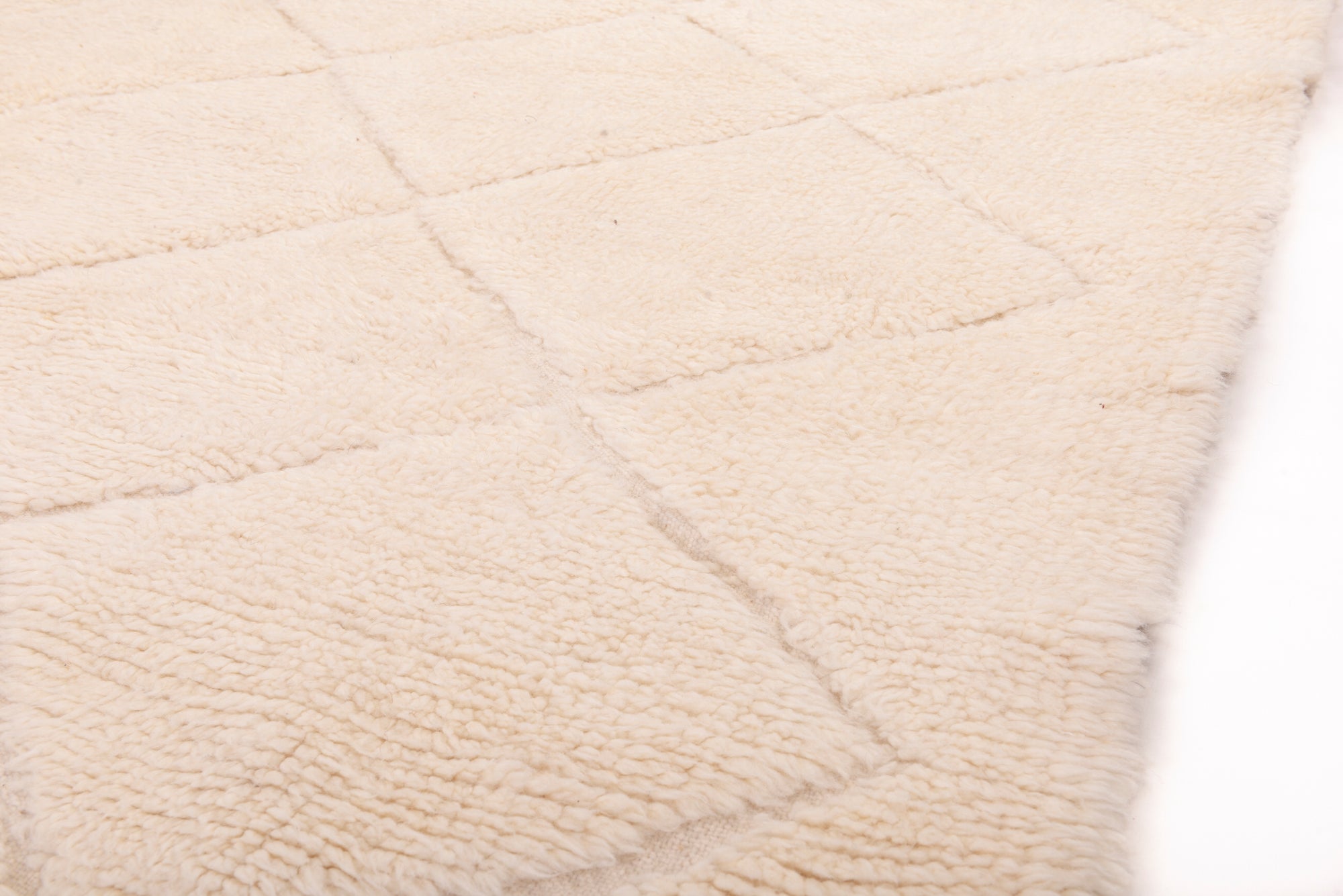 Elevate your decor with our Ivory 3D Crisscross Berber Rug. This classic design boasts a modern twist, with its 3D effect adding depth and sophistication to any room.