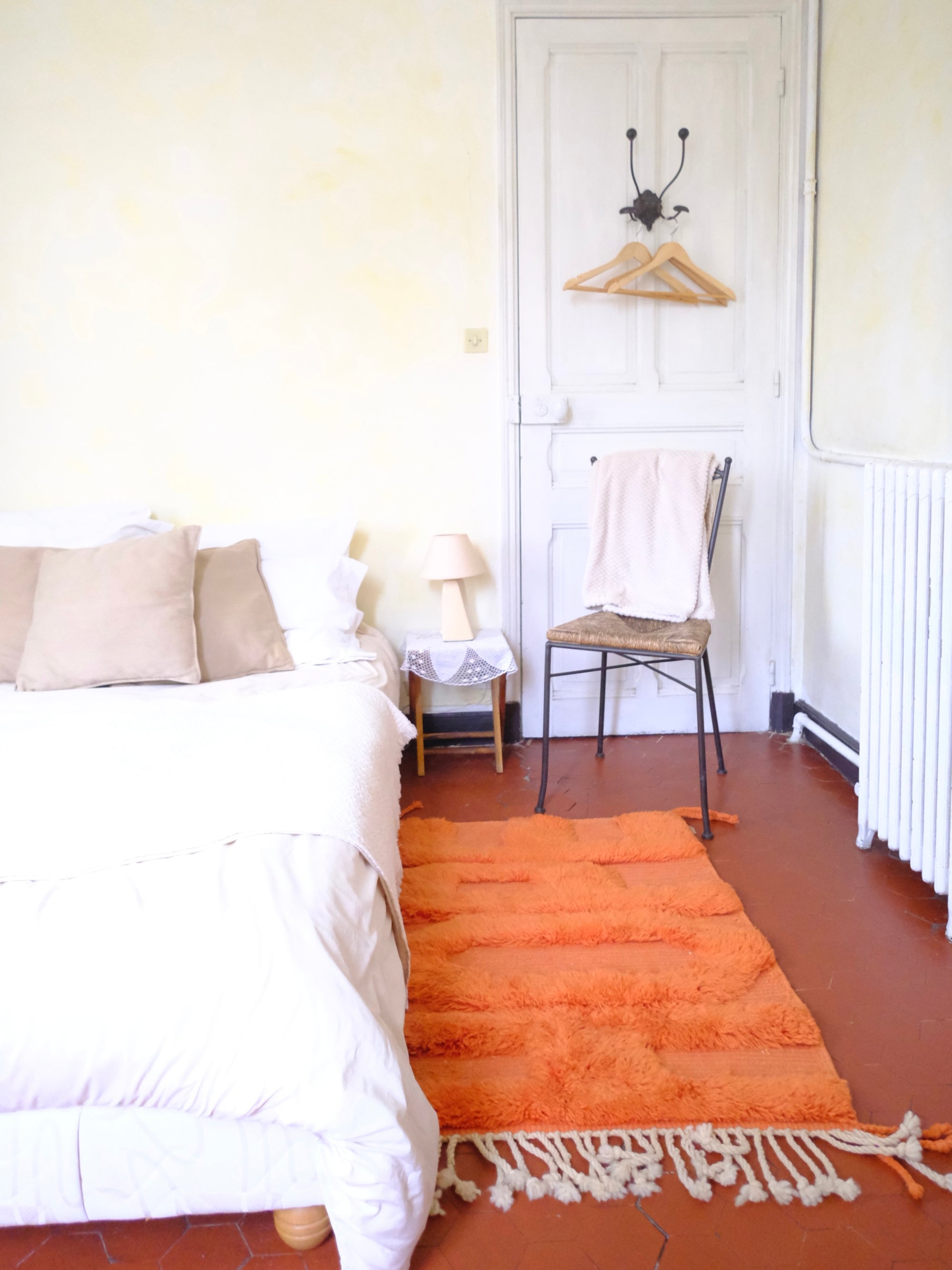 Introducing our 'Tangerine Hope Haven Rug,' a captivating masterpiece featuring bold knotted 'Hope' letters intricately woven with fuzzy texture. Crafted with vegetable dye orange yarn and set on a flat weave base, this rug is a harmonious fusion of vibrancy and classic charm. Elevate your space with its unique design, embodying positive energy and artisanal craftsmanship