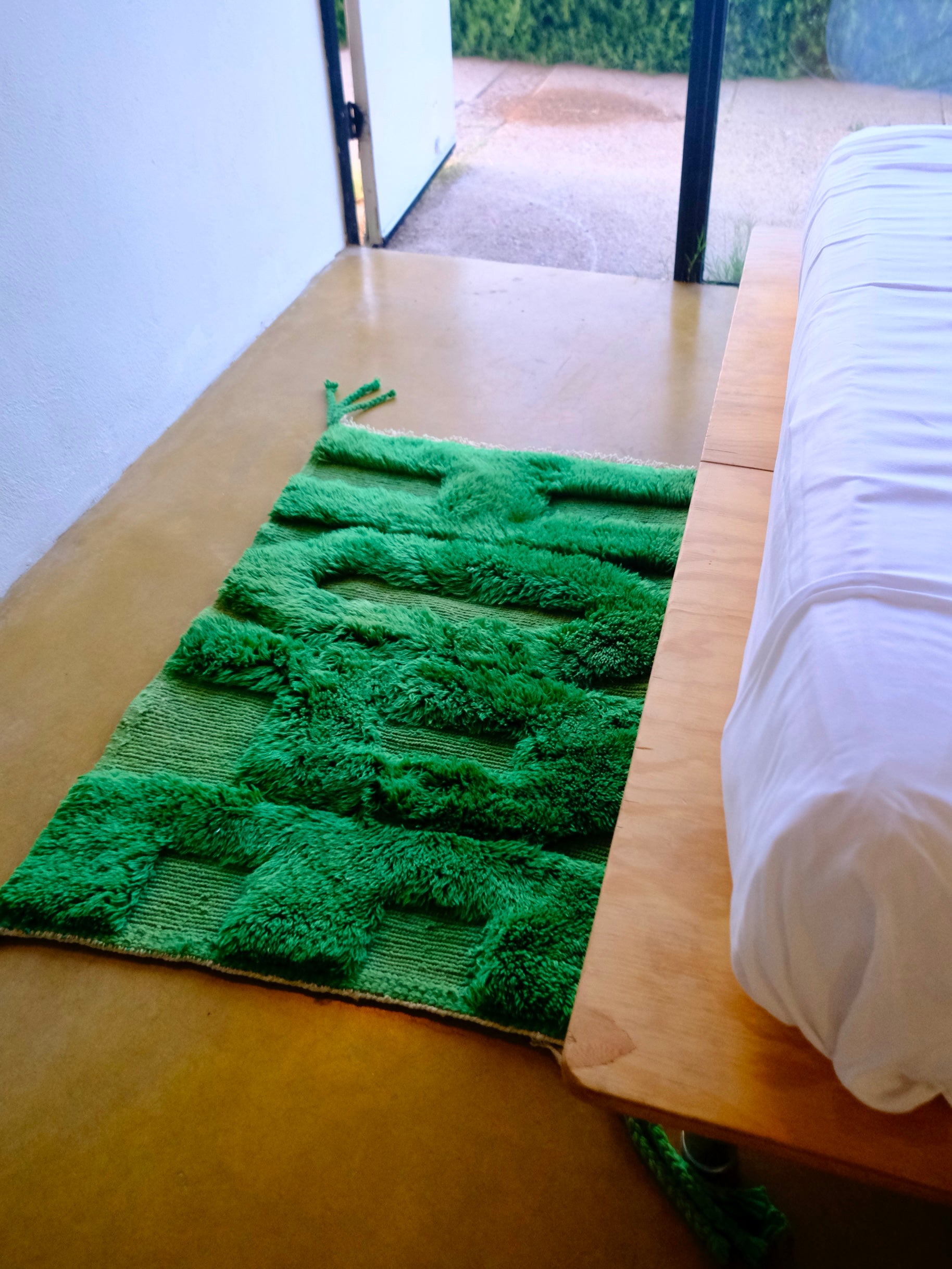 Discover our 'Emerald Fuzzed Hope Rug,' a remarkable fusion of classic sophistication and vibrant playful energy. Expertly crafted with bold knotted 'Hope' letters in rich green yarn, this rug adds a touch of uniqueness to any space. The textured charm and spirited design make it a captivating addition that brings positive energy and timeless elegance to your home.