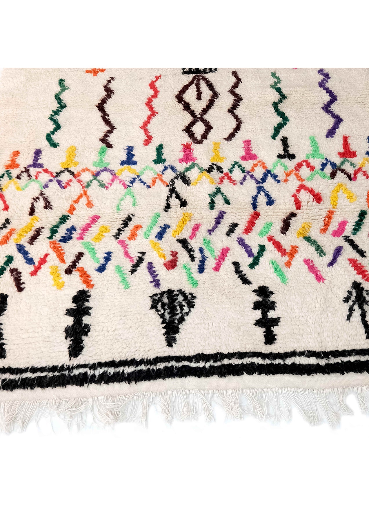 The George Ivory Azilal Rug will make a sumptuous statement in your living room, bedroom, or guest room! This beautiful rug is handmade from 100% natural wool that will stand the test of time while adding a touch of contemporary, luxurious softness to any room of the home. Featuring a pastel drawing design, this rug is ideal for use as a focal point in your living space